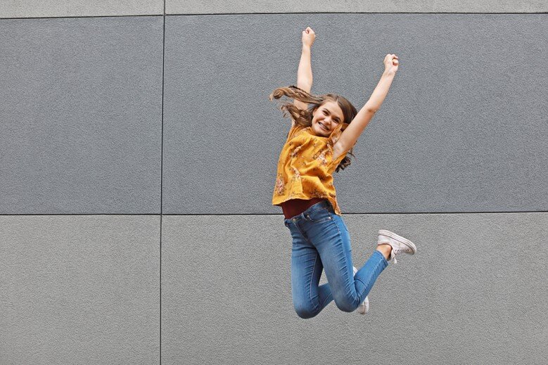 Sneakers and jeans means we get to JUMP! Love this girl!